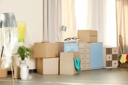 Furniture removals team handling household items in St Johns Wood