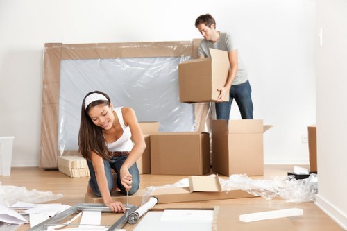 Packed office equipment and furniture prepared for removal in northwest London