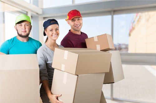 House removals team handling moving boxes in St Johns Wood