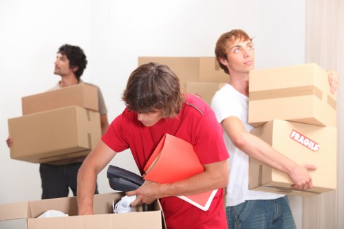 Moving crew handling office equipment during a St Johns Wood business move