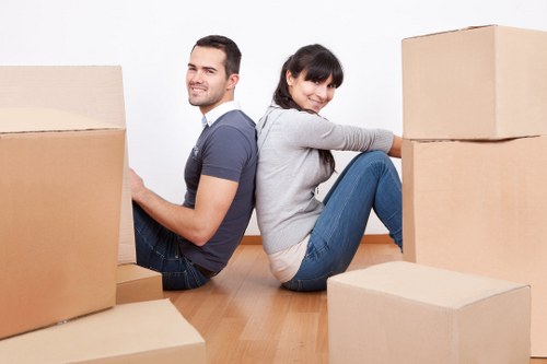 Packed office furniture and IT equipment ready for a business move in St Johns Wood
