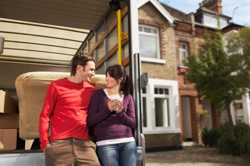 Professional movers loading furniture into a truck for a local relocation