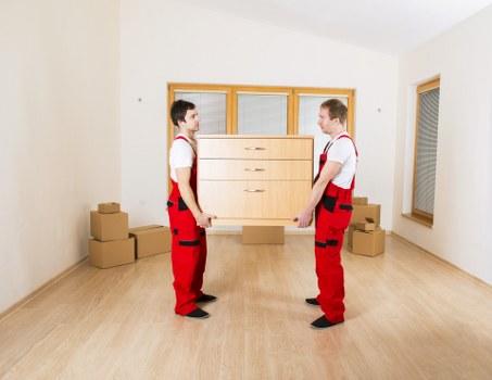 Careful loading of boxes and home items by a man with van service